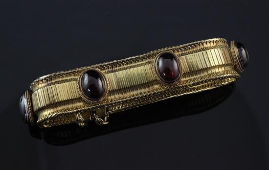 A late 19th/early 20th century gold and garnet snake link bracelet,